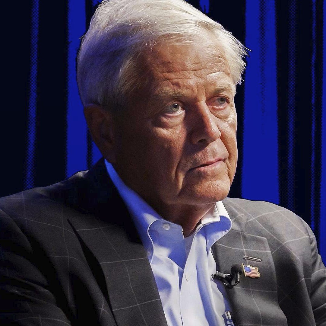 Rep. Ralph Norman giving an interview against a blue background